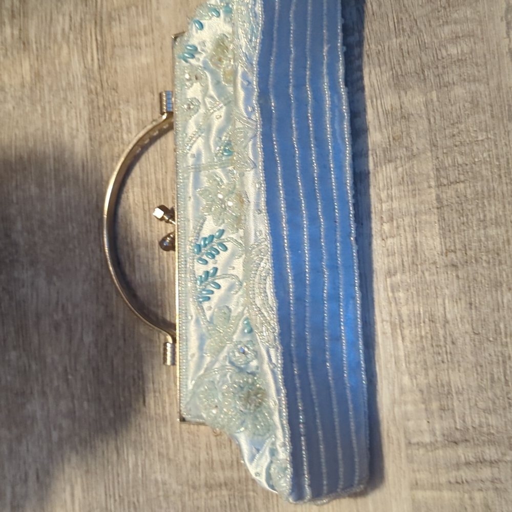 2 for $20 Beautiful beaded clutch. Used once. Light blue with silver accents.